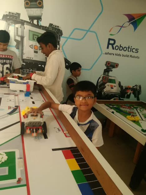 Young innovator programming a robot